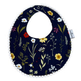 Babero Reversible de Flores con Fondo Azul y Puntos.