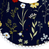 Babero Reversible de Flores con Fondo Azul y Puntos.